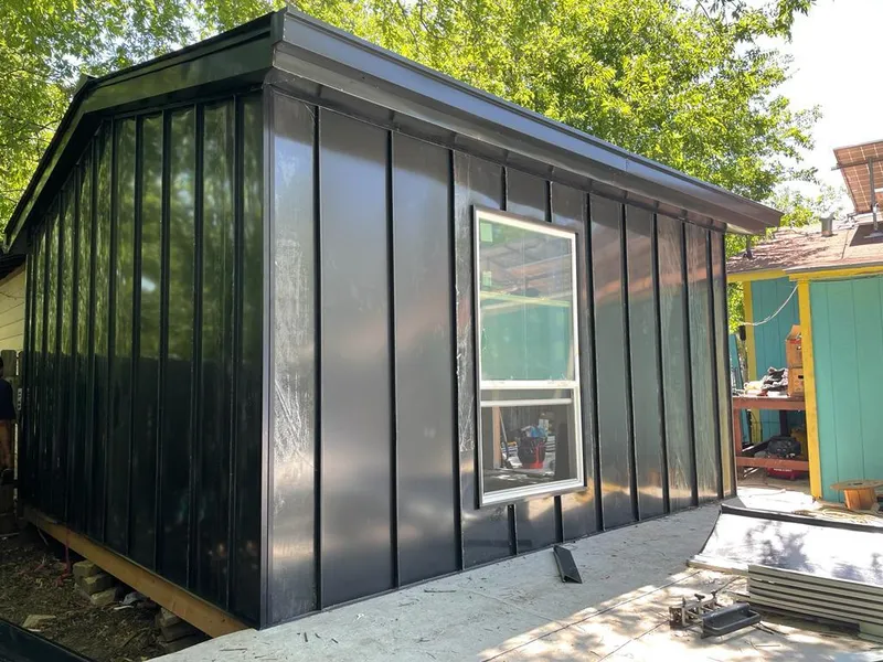 Black standing seam metal wall panels for Roof Inspection in Bell Gardens