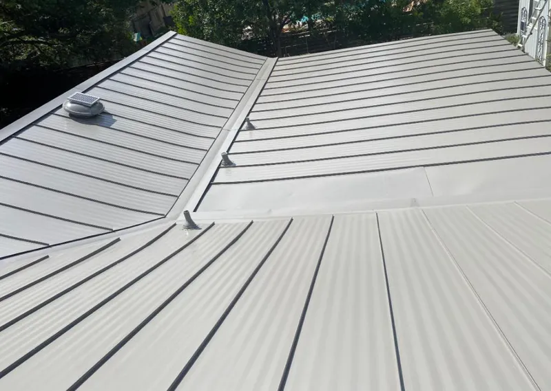 Solar attic fan installed on a metal roof for Roof Ventilation in Bell Gardens
